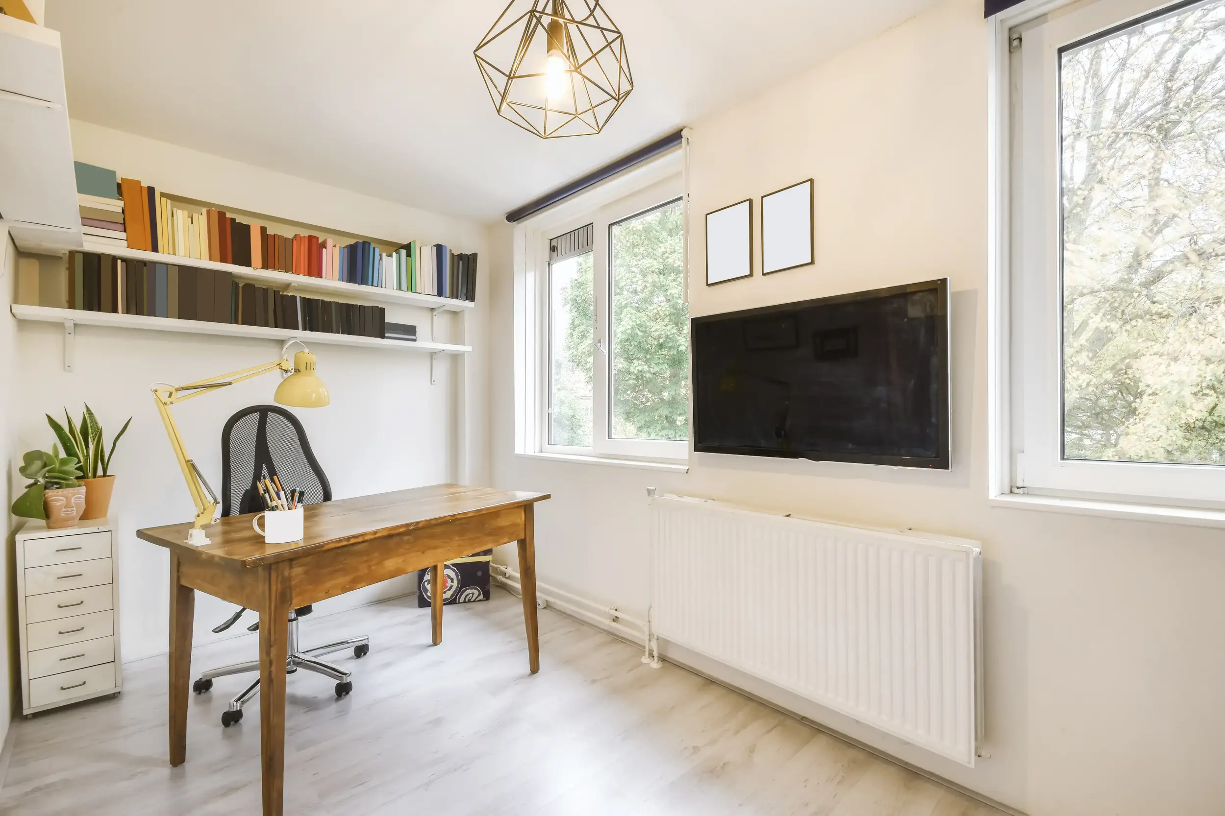 Compact home office nook with cozy study area and wooden table in Lynde Shores Whitby